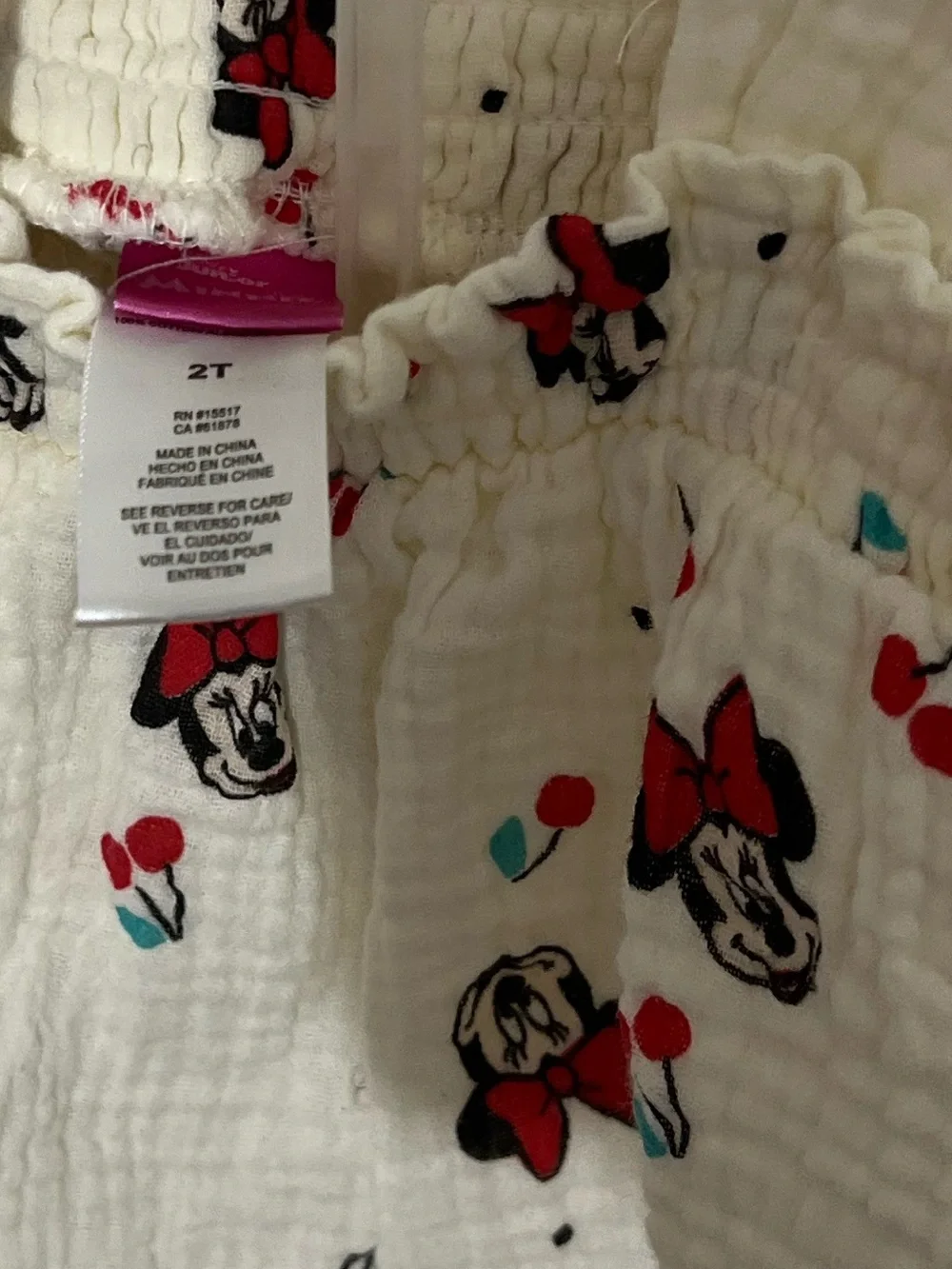 Disney Cream Baby Romper with Red and Black Minnie Faces and Teal Accents